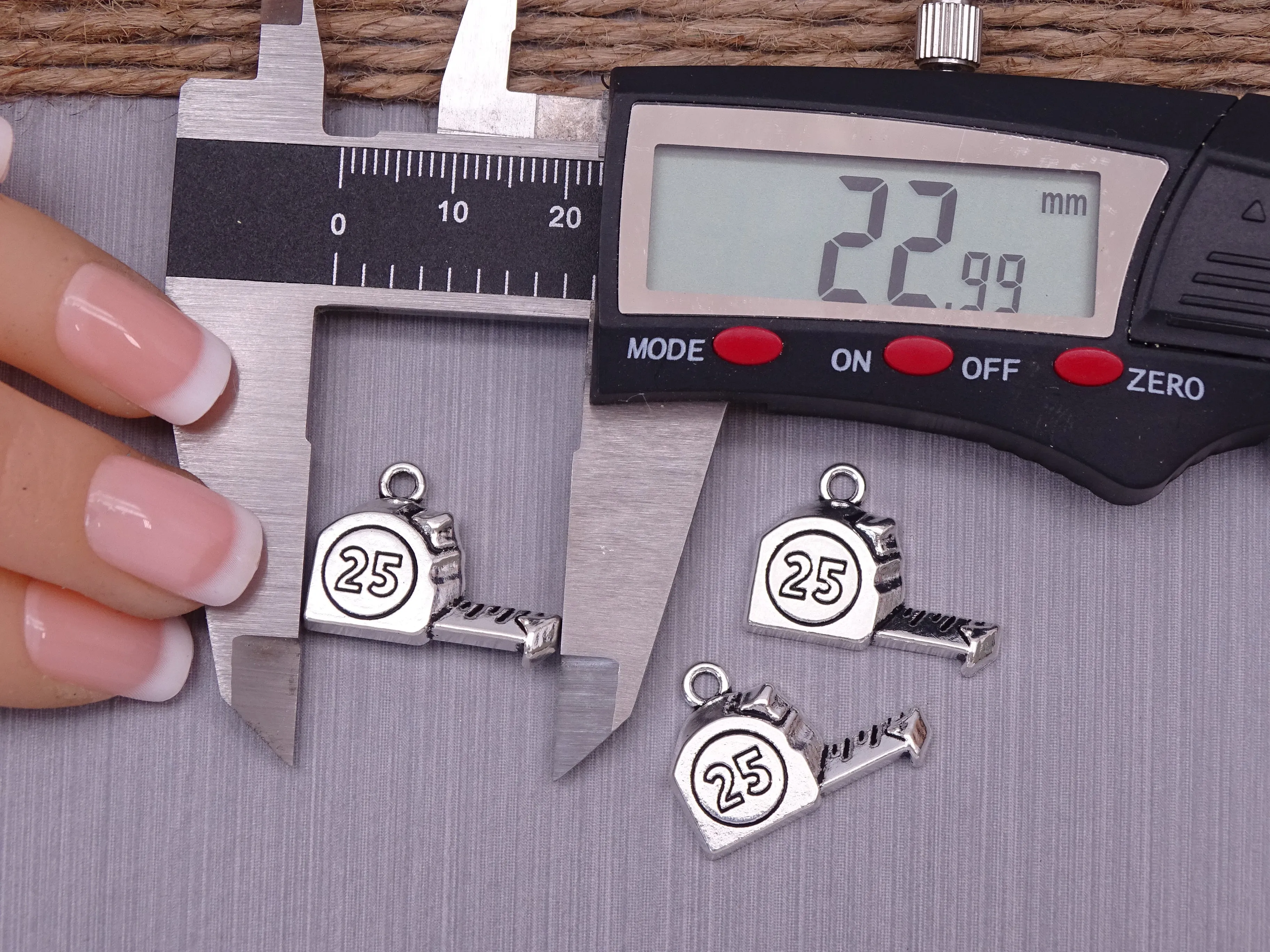 12 pc tape measure charm . stainless steel charm ,very high quality.Perfect for jewery making and other DIY projects