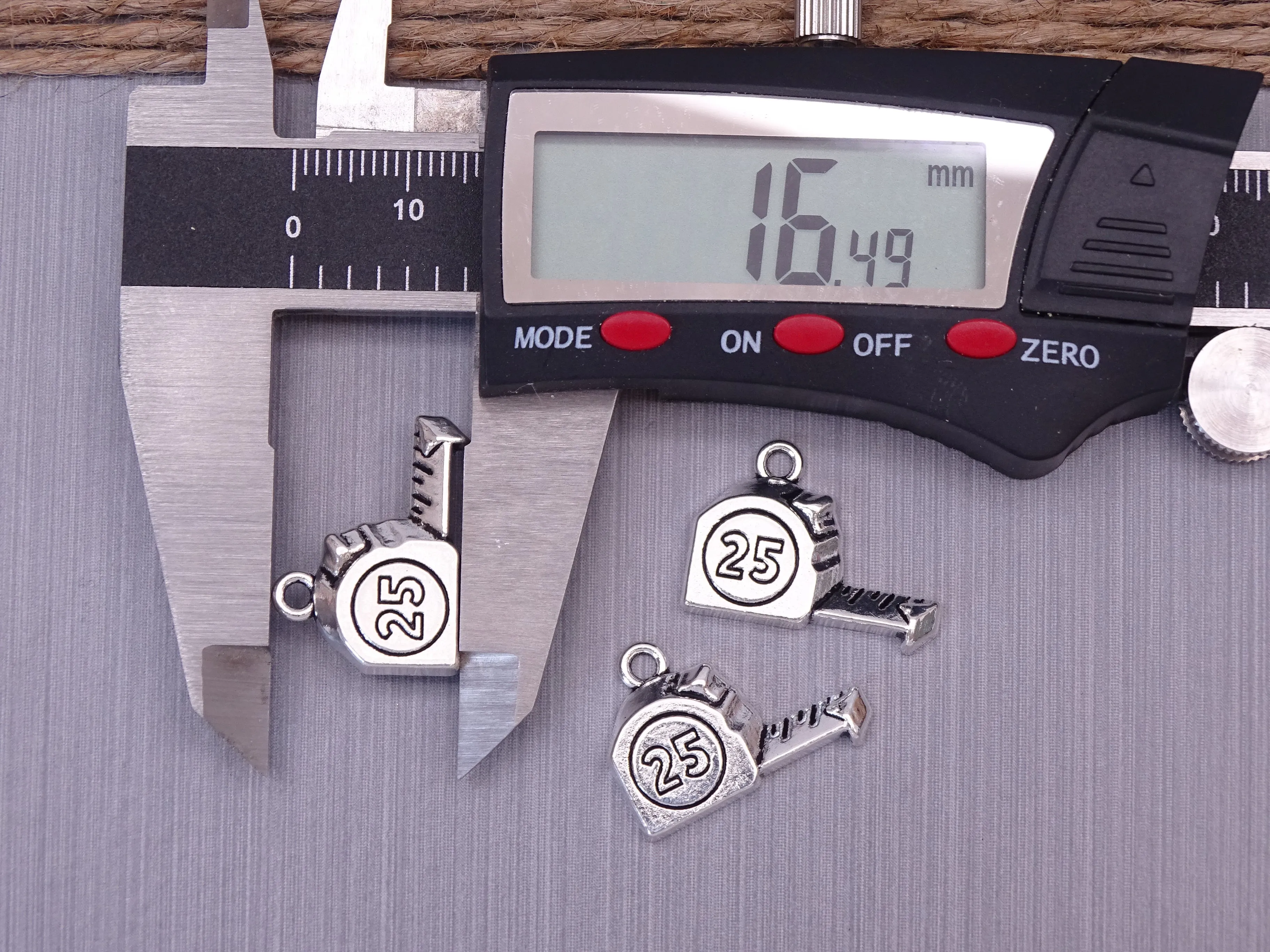 12 pc tape measure charm . stainless steel charm ,very high quality.Perfect for jewery making and other DIY projects