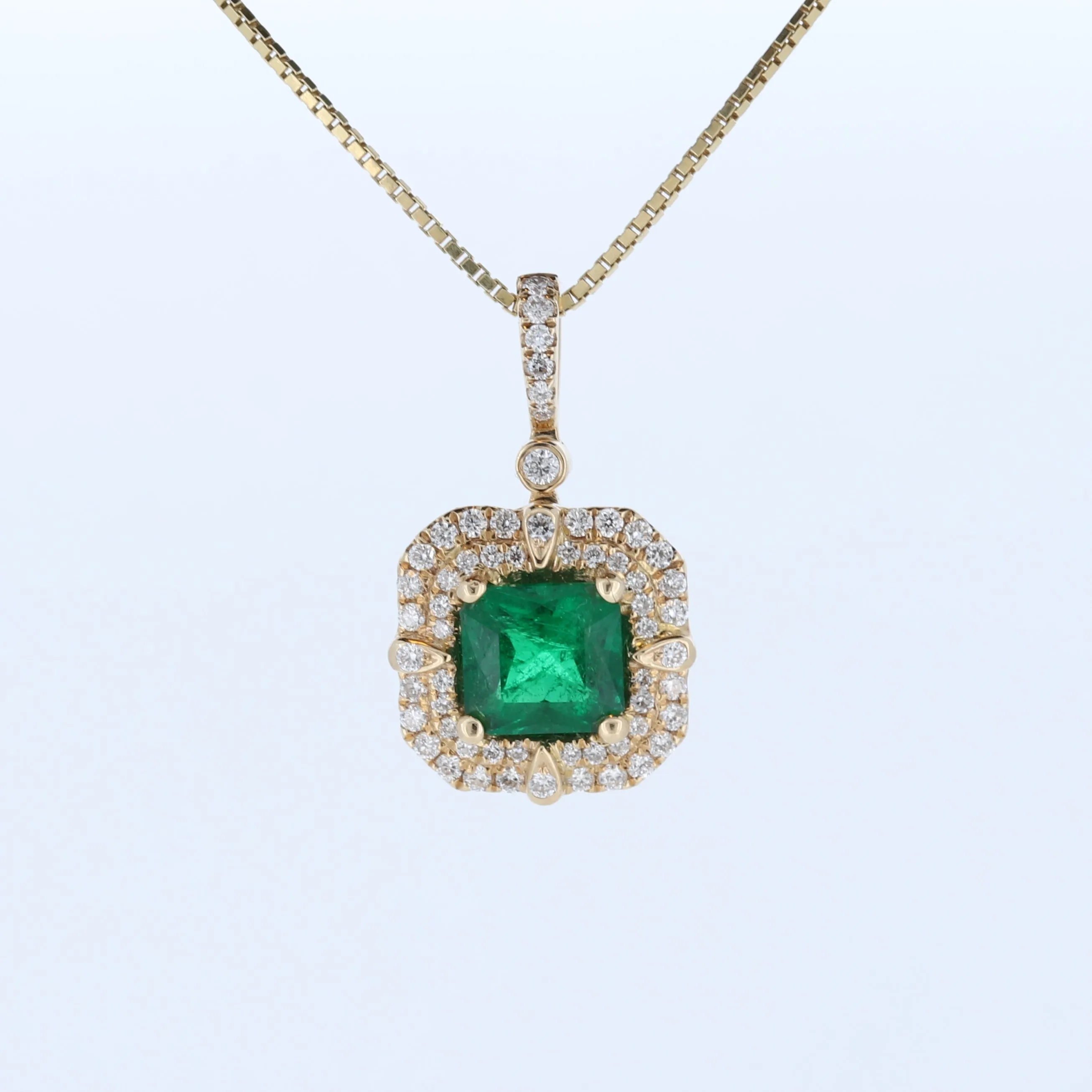 Cushion Emerald And Double Halo Diamond Pendant In 14Kt Yellow Gold