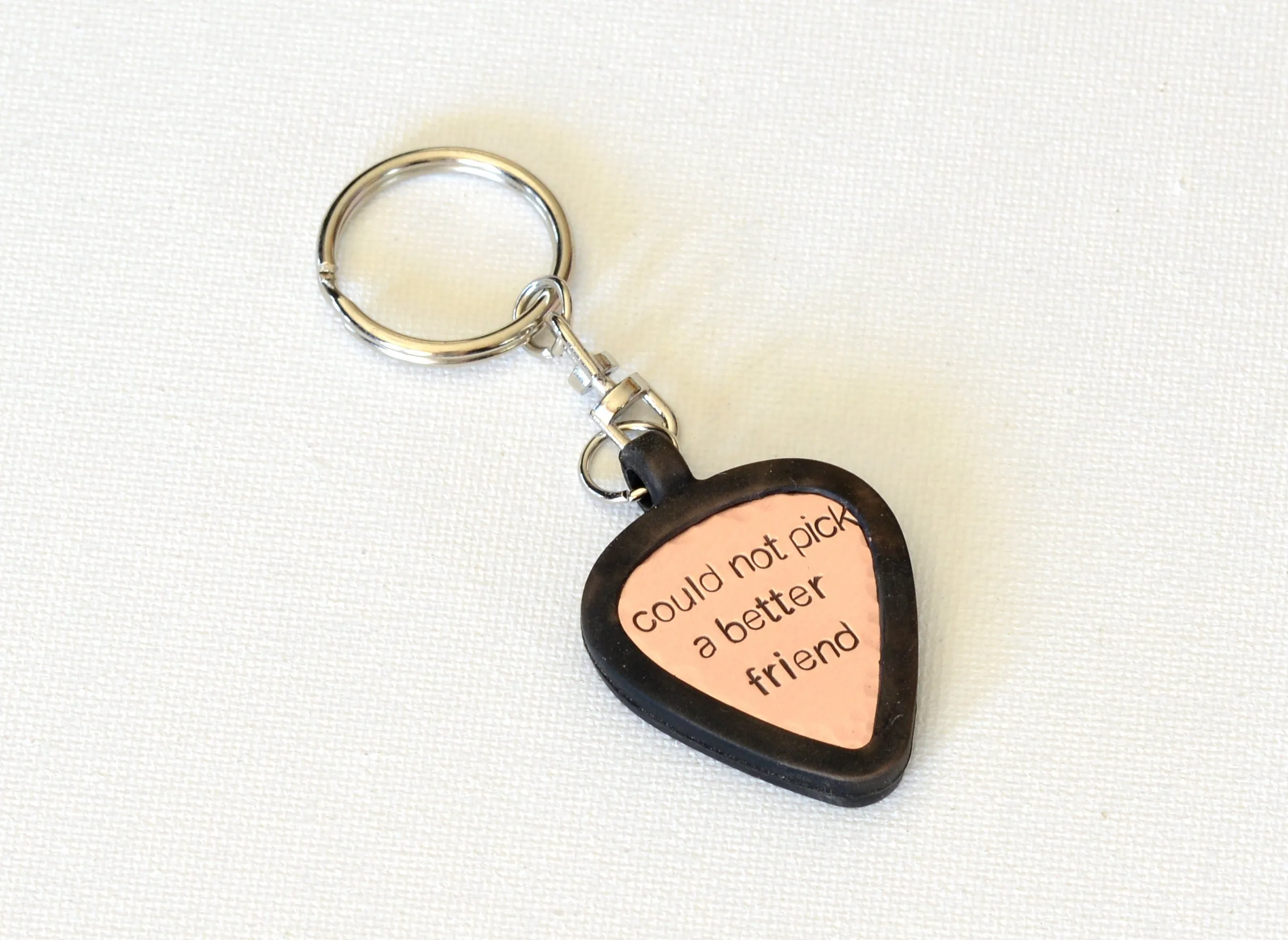 Customized copper guitar pick with rubber holder