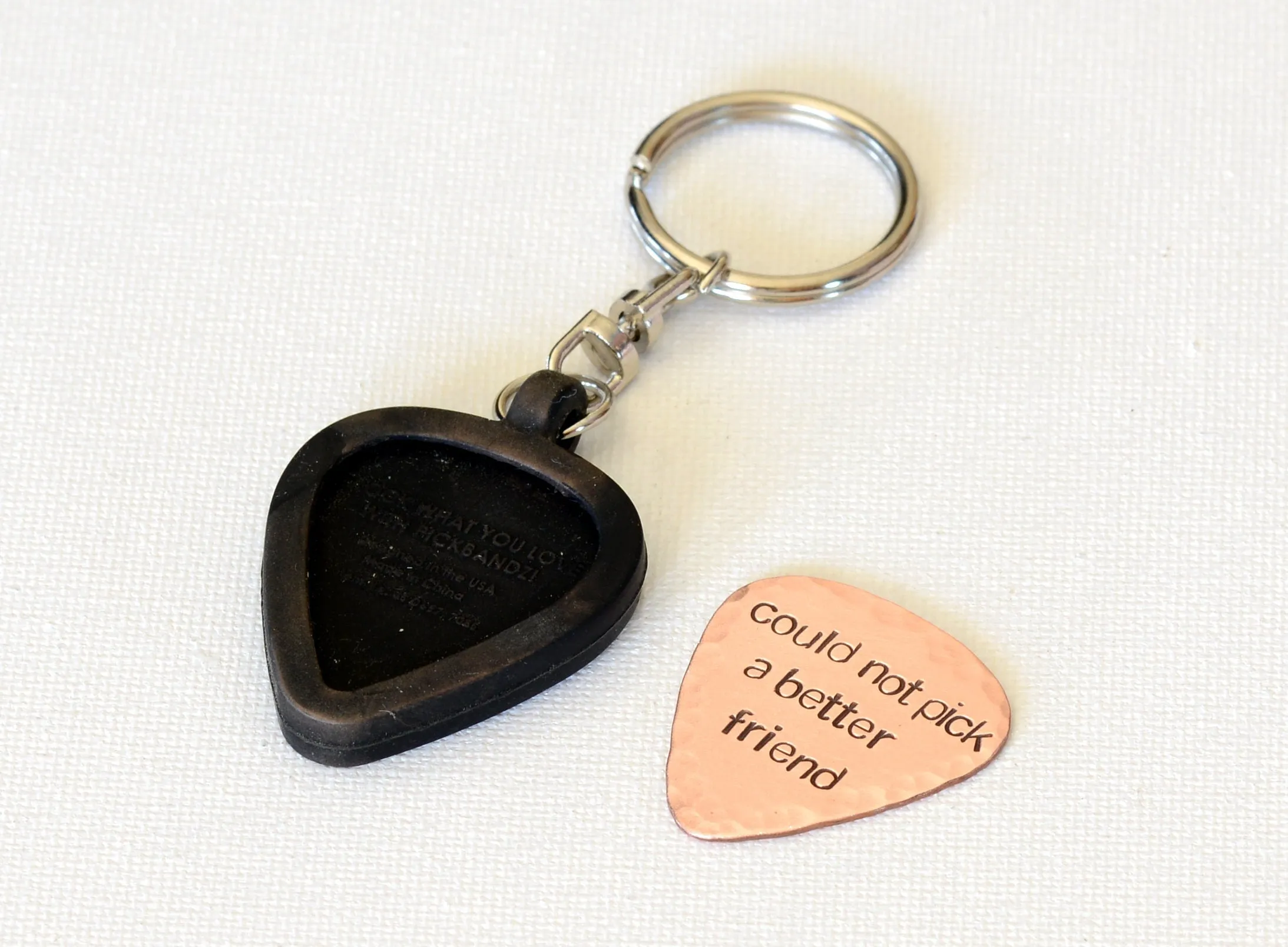 Customized copper guitar pick with rubber holder
