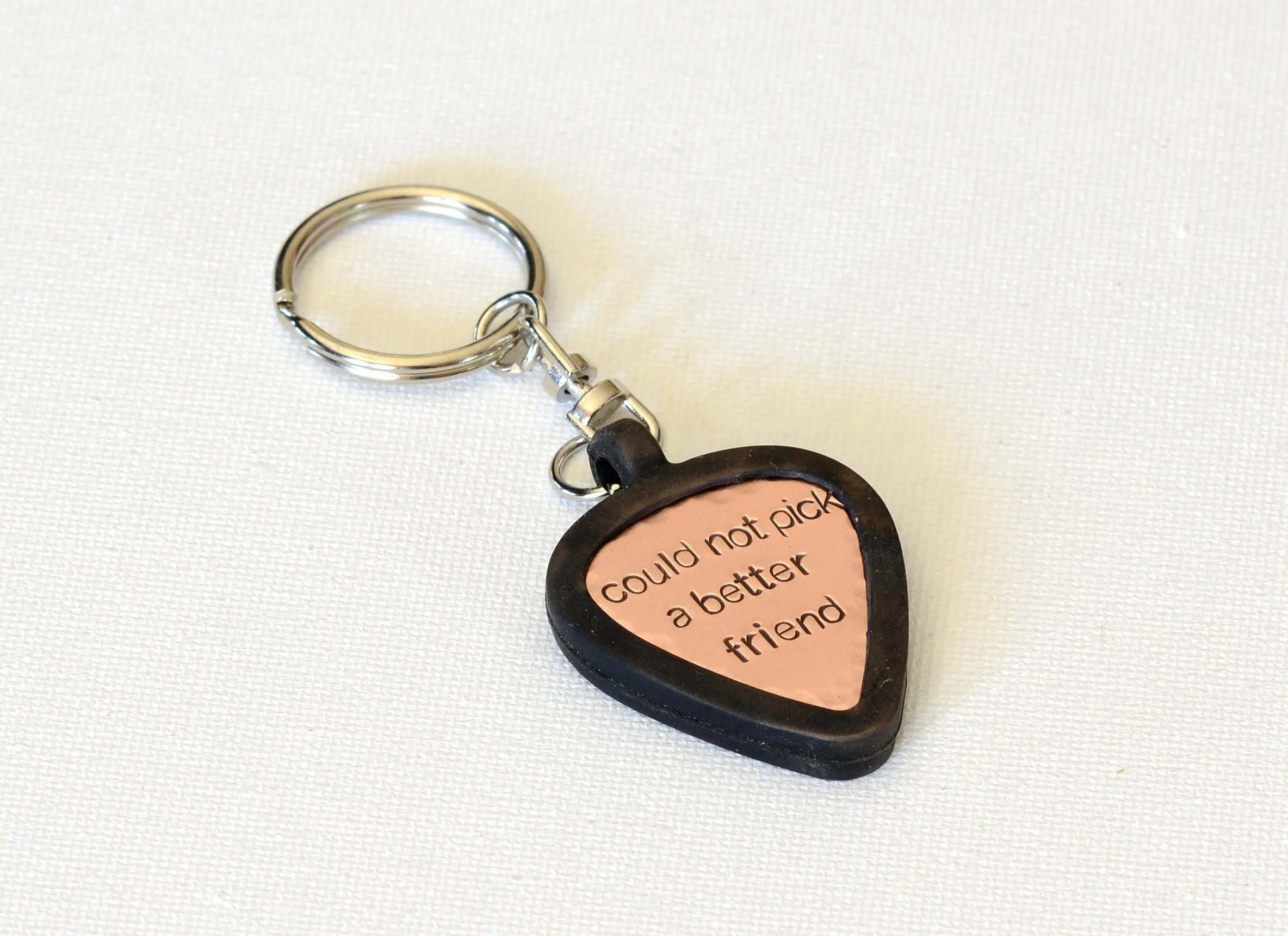 Customized copper guitar pick with rubber holder