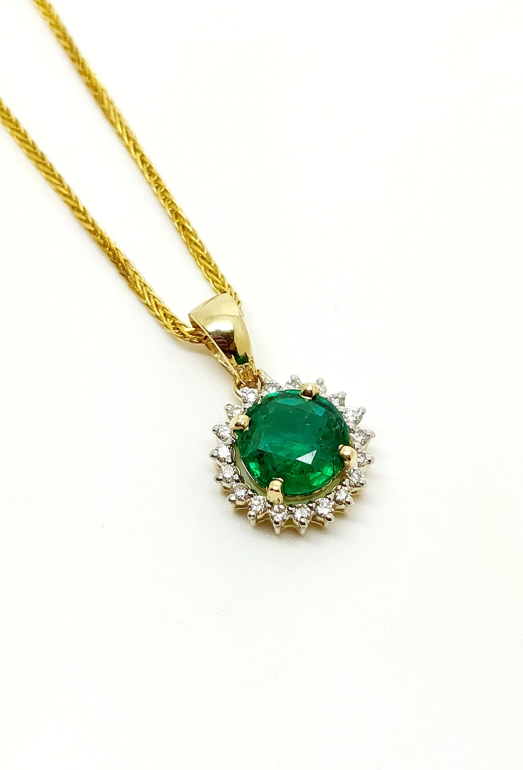 Emerald And Diamond Halo Pendant In 14k Yellow Gold