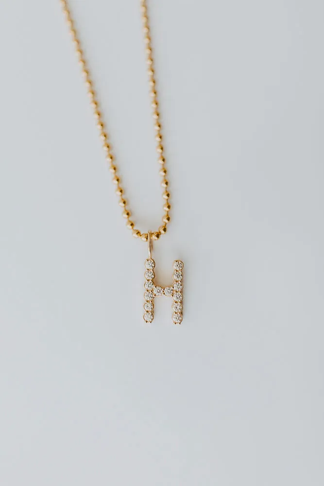 Large Initial Charms