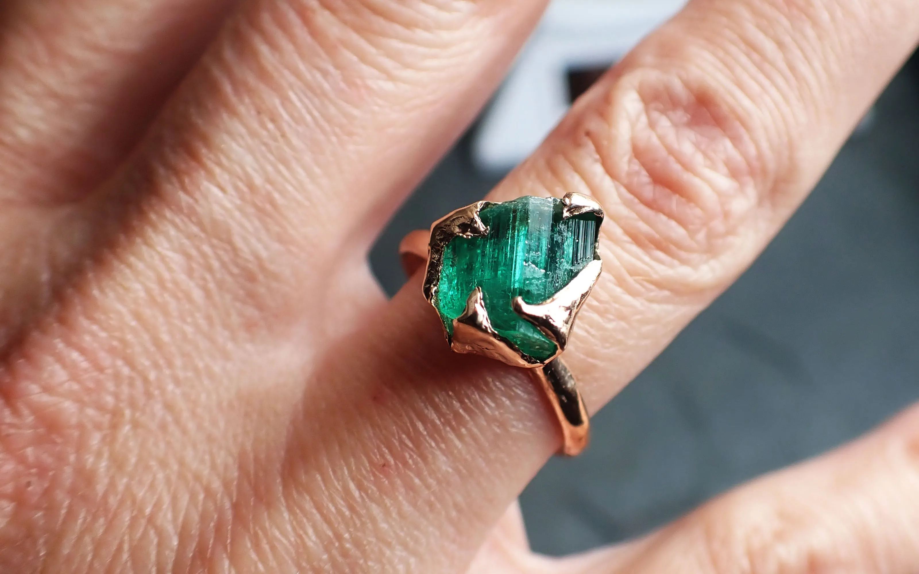 raw emerald ring in 14k rose gold green uncut rough gemstone recycled gold 2320 Alternative Engagement