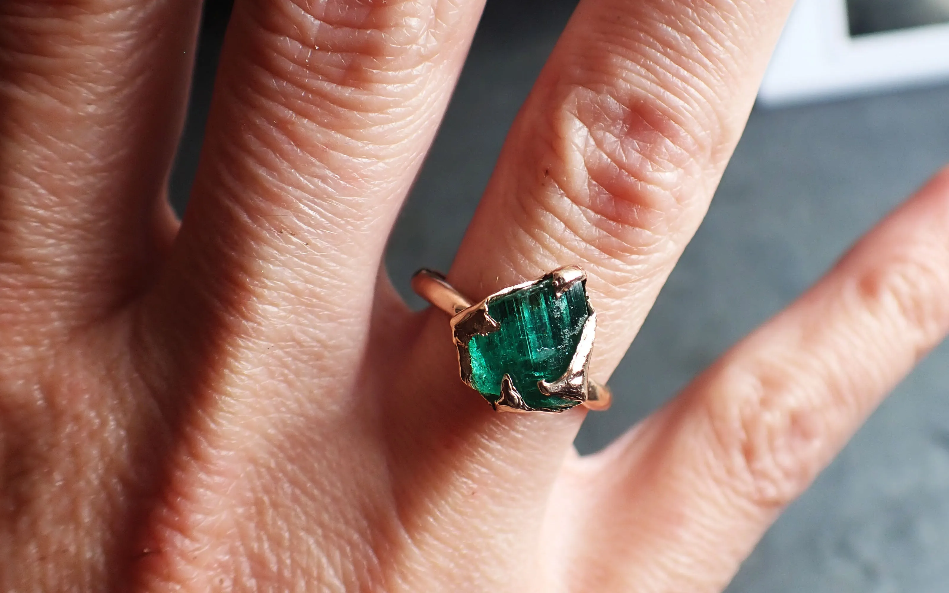 raw emerald ring in 14k rose gold green uncut rough gemstone recycled gold 2320 Alternative Engagement