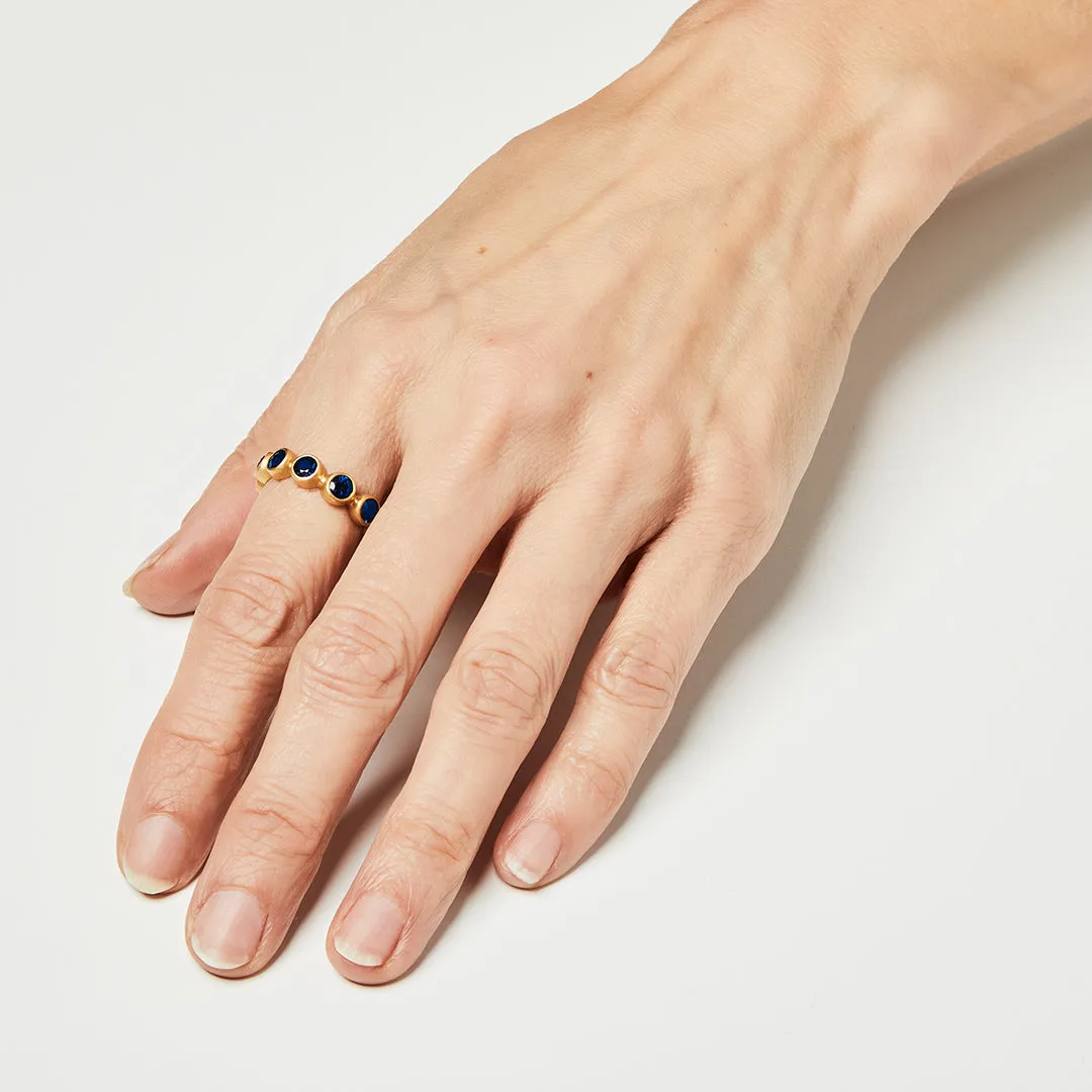 Renaissance Faceted Round Blue Sapphire Band in 20K Peach Gold