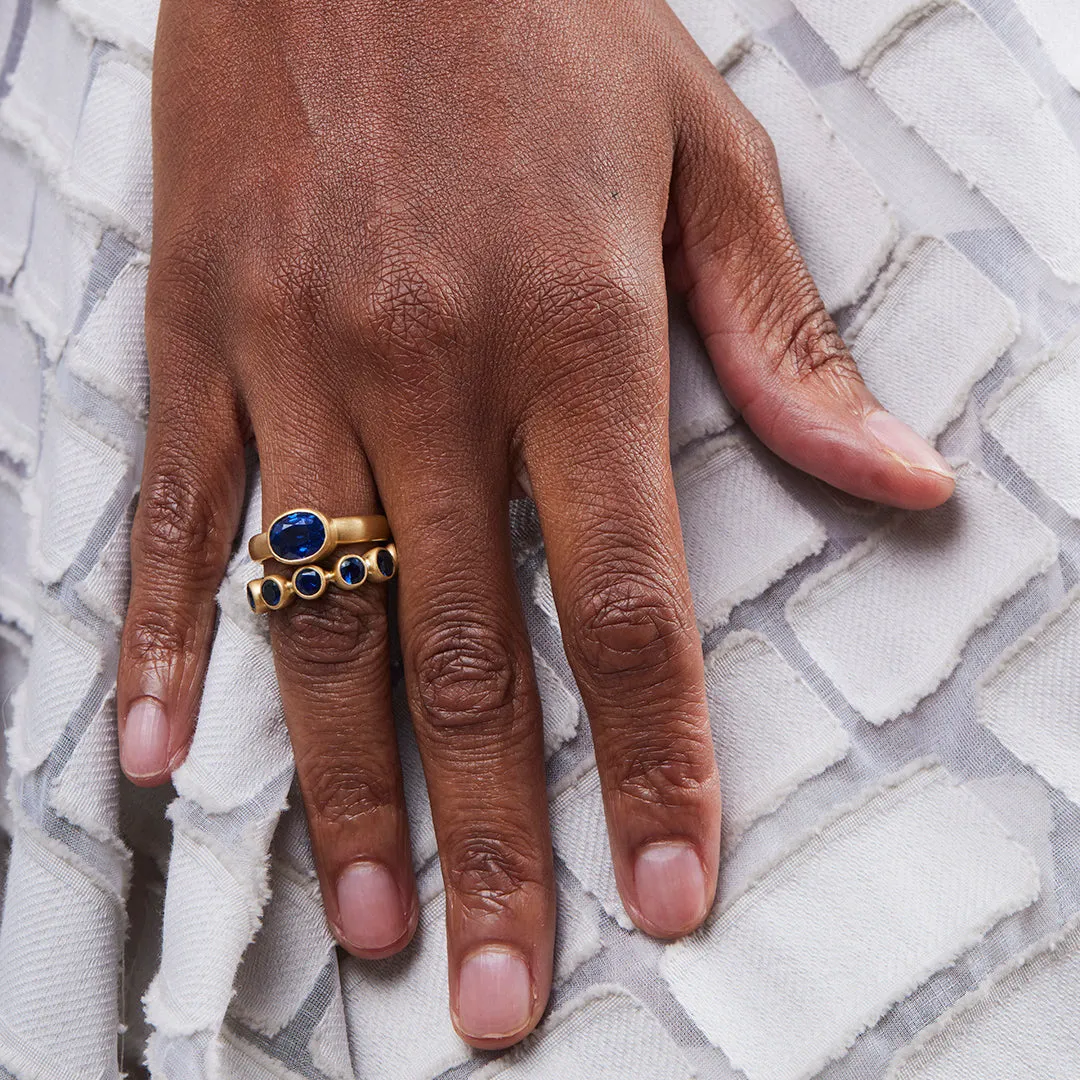 Renaissance Faceted Round Blue Sapphire Band in 20K Peach Gold