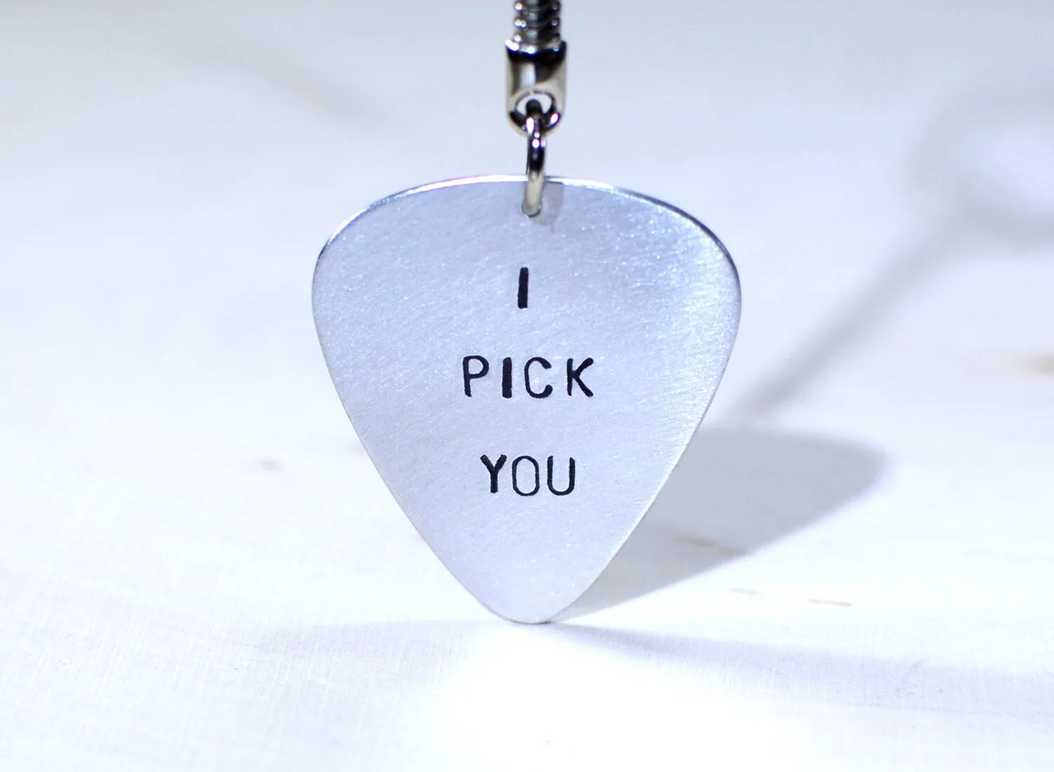 Sterling silver guitar pick key chain with I pick you