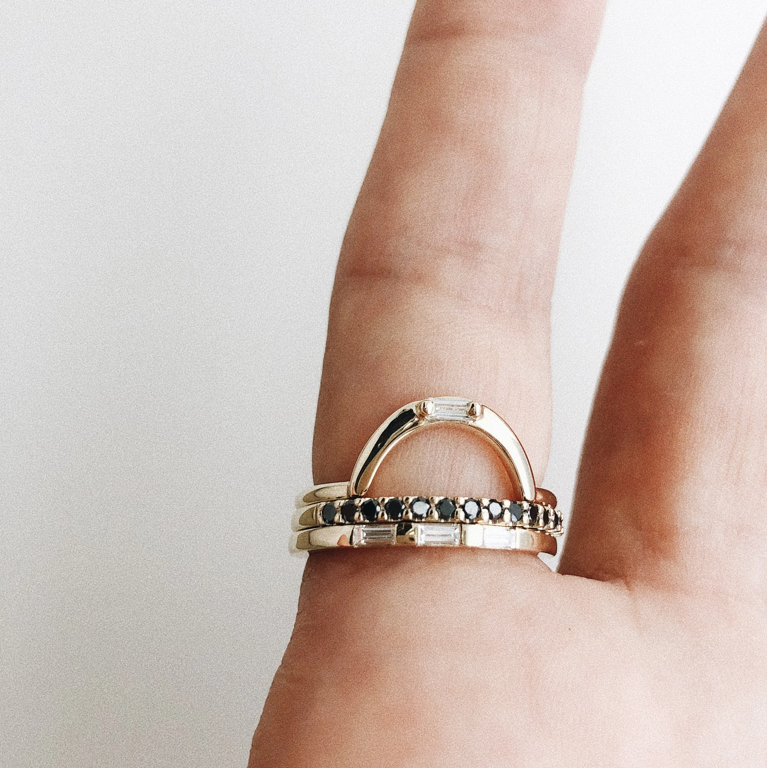 White Baguette Diamond Arch Band in Yellow Gold